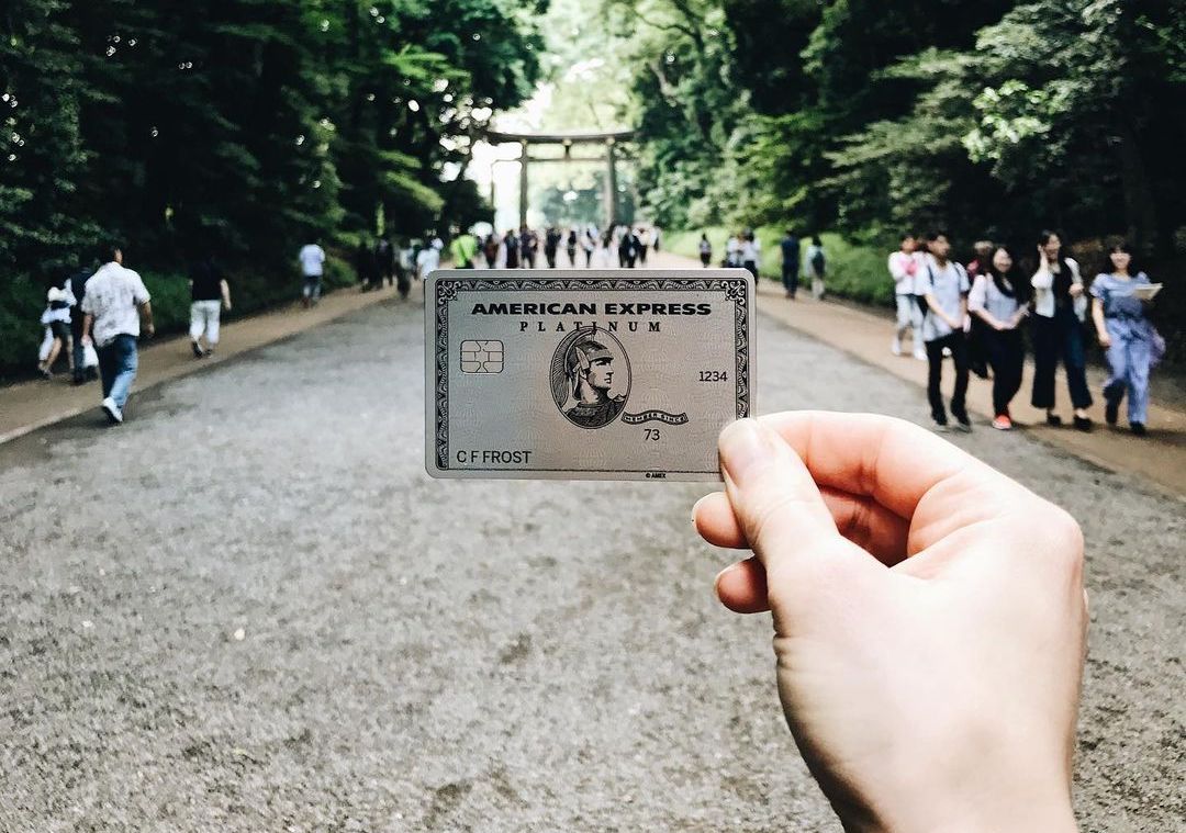An American Express Platinum card being held up in Tokyo