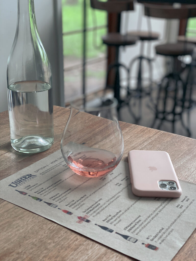 Wine glass on a table at Usher Tinkler winery.