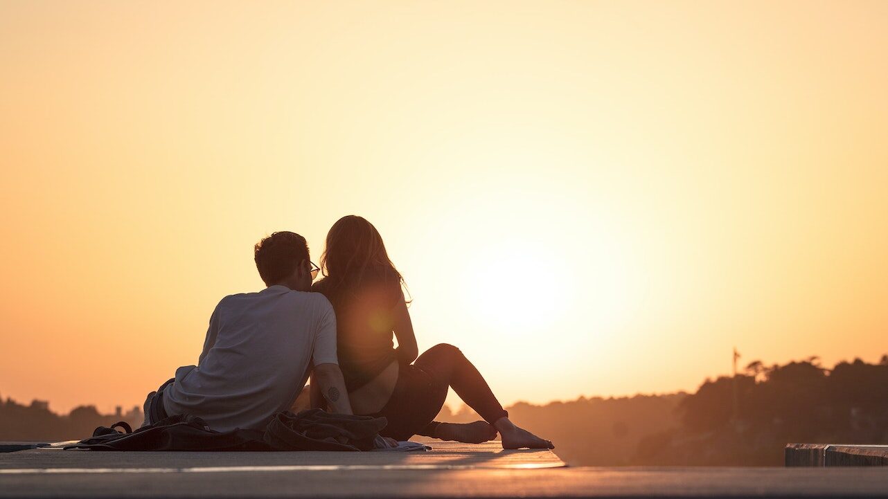A couple admiring a sunset