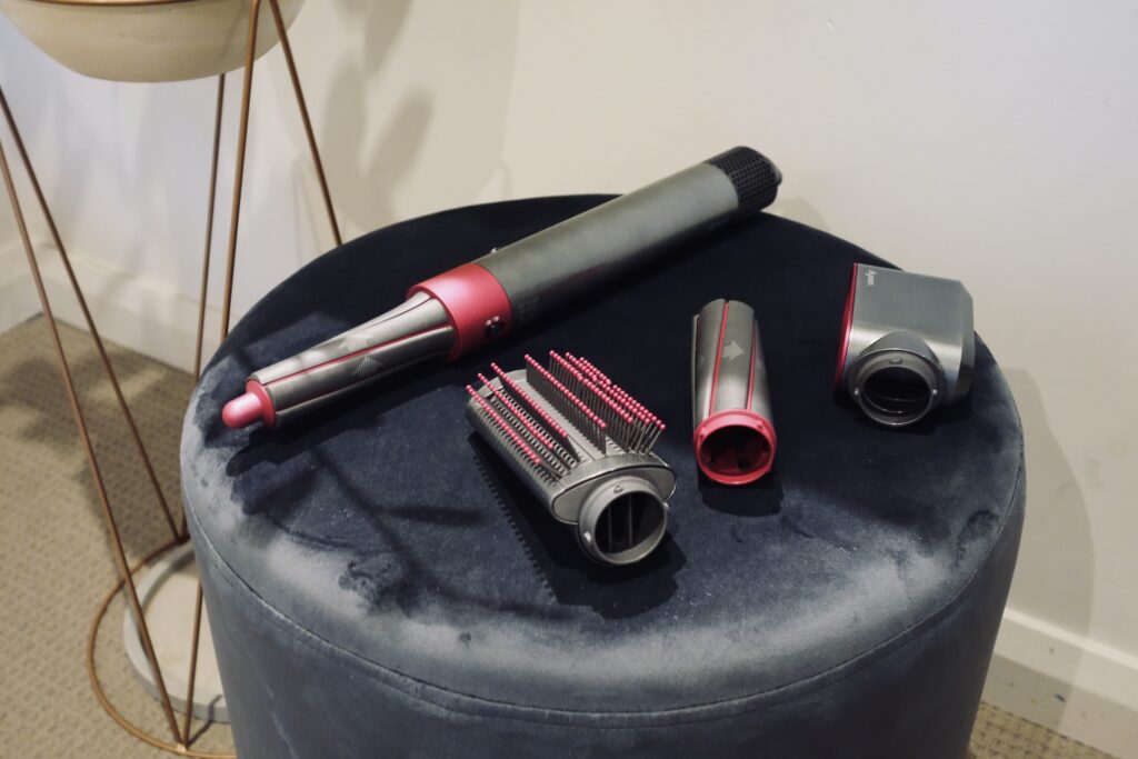 Dyson Airwrap hair styler on a chair