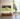 Samsung The Frame 2022 TV wall mounted in a well lit room with a man standing beside it