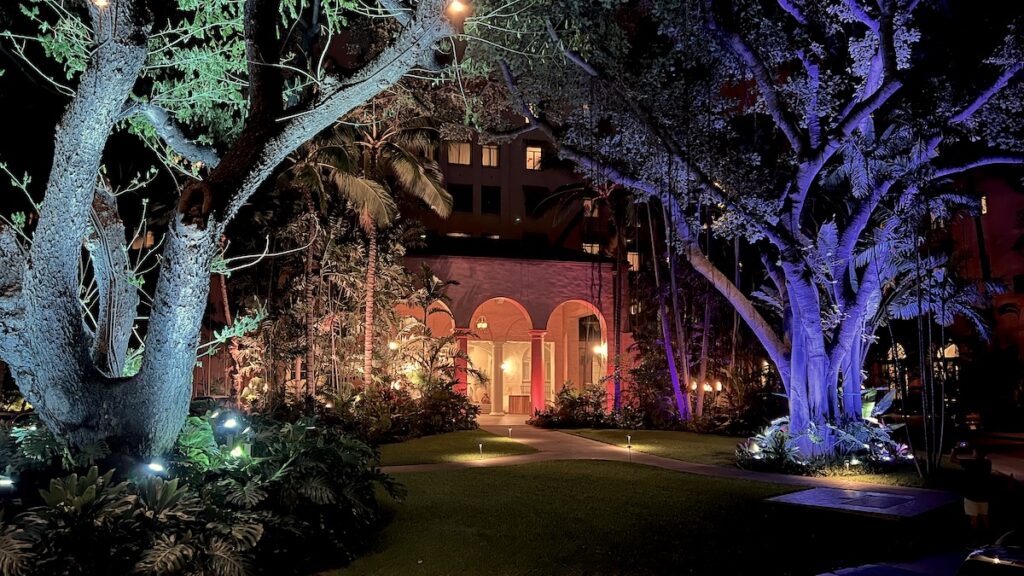 The gardens of the Royal Hawaiian Hotel in Waikiki at night