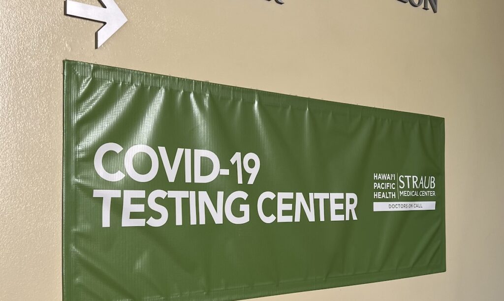 Sign for a COVID-19 testing centre at the Sheraton Waikiki hotel
