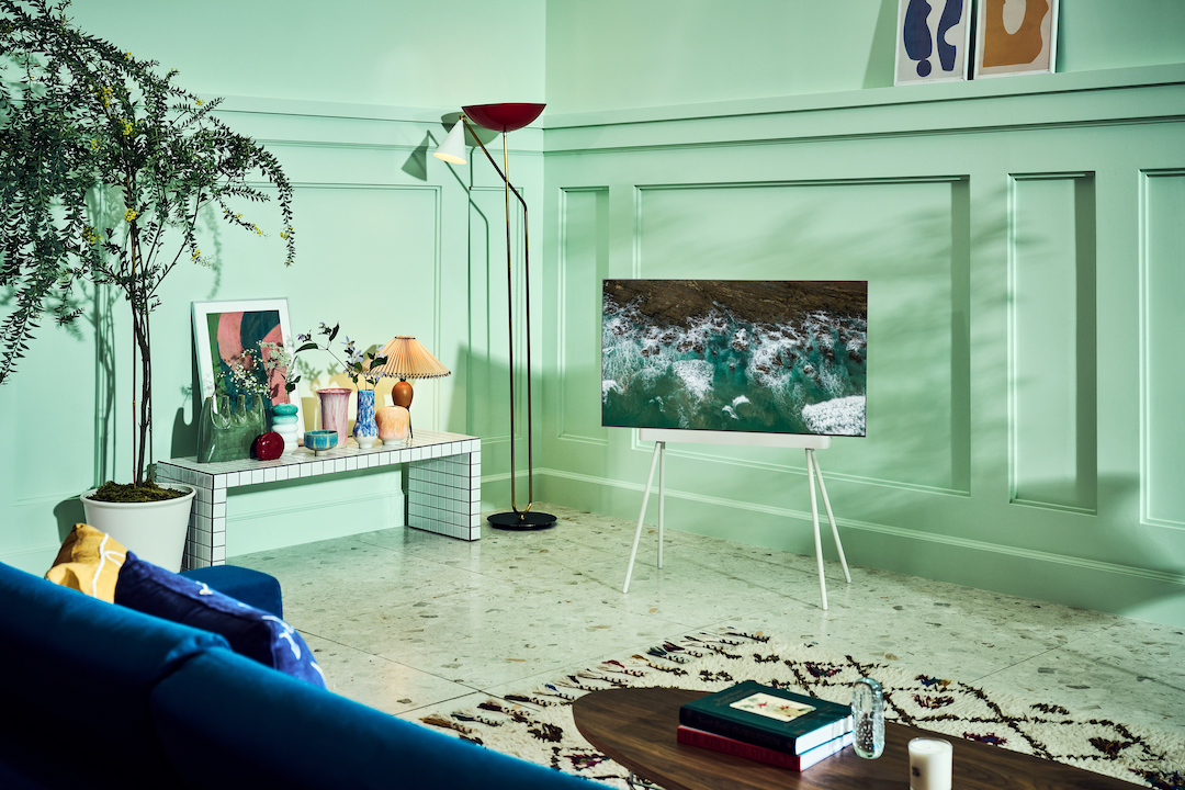 LG C2 OLED sitting in a mint green-painted lounge room