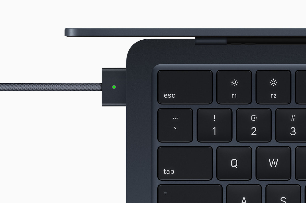 Apple MacBook Air with MagSafe charger plugged in