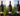 Three bottles of St Hugo Single Vineyard wine in fromt of vineyards