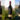 Three bottles of St Hugo Single Vineyard wine in fromt of vineyards