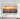Samsung The Frame TV 2023 model hanging on a white wall with a sunset cityscape on the screen