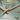 Green Tag Heuer Carrera 2023 close-up with gold posts and hands