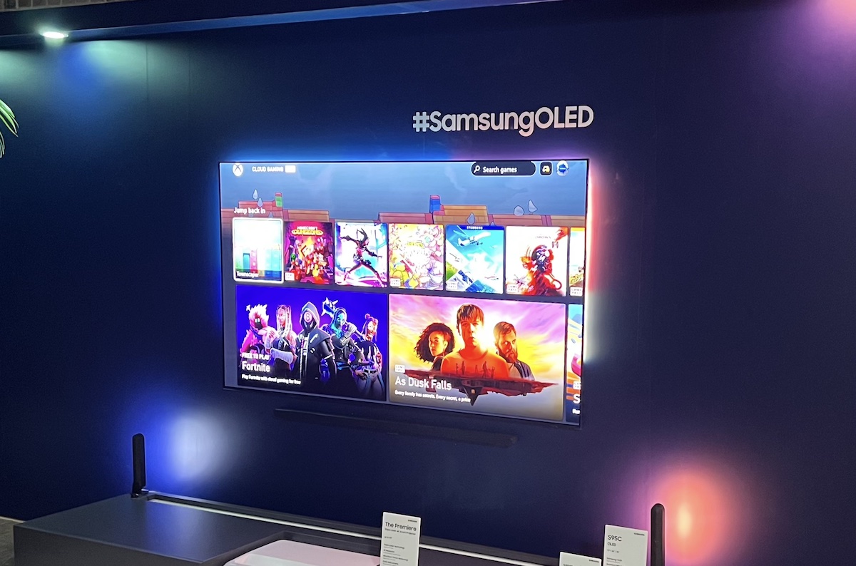 A Samsung OLED hanging on the wall displaying Xbox cloud games available to play